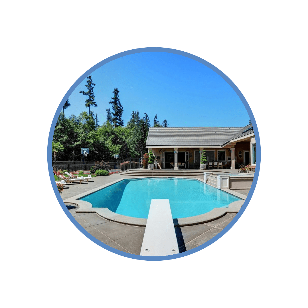 A pool with a deck and some trees