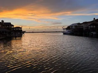 A body of water with boats docked in it.