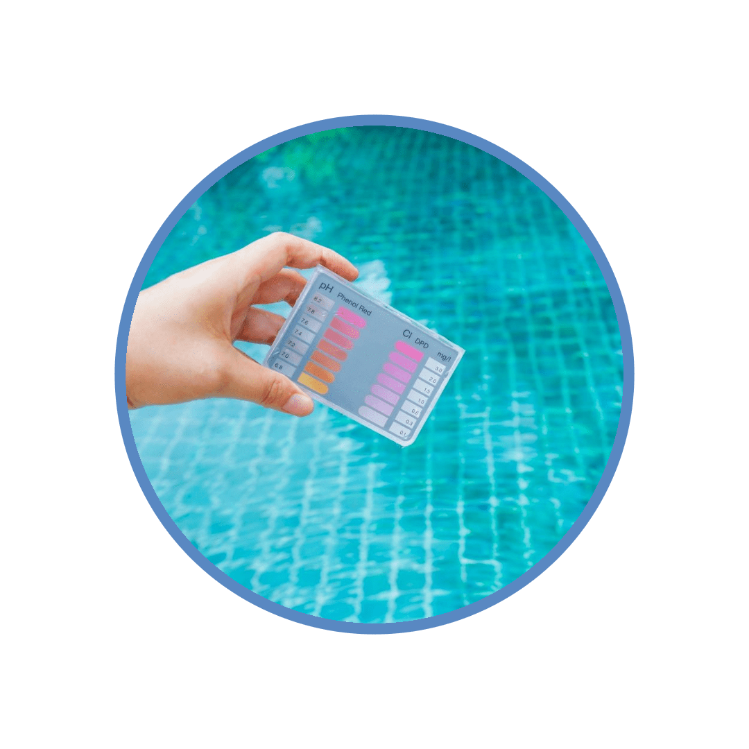 A hand holding an empty container in front of a pool.